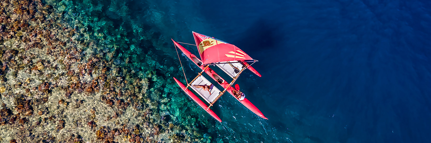 Sailing Outrigger Canoe on reef
